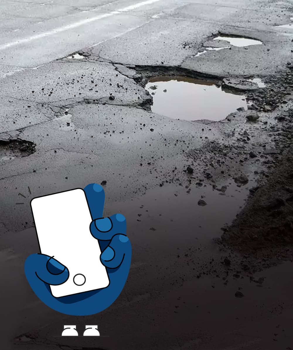 Citizen taking a photo of an issue on the street